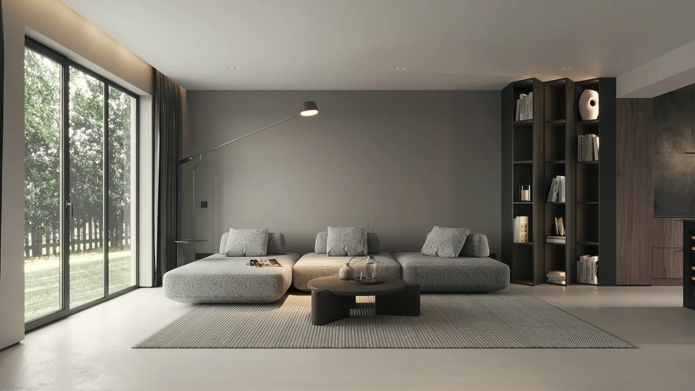 A living space turned toward a full-height window, the furniture kept below the sill line.