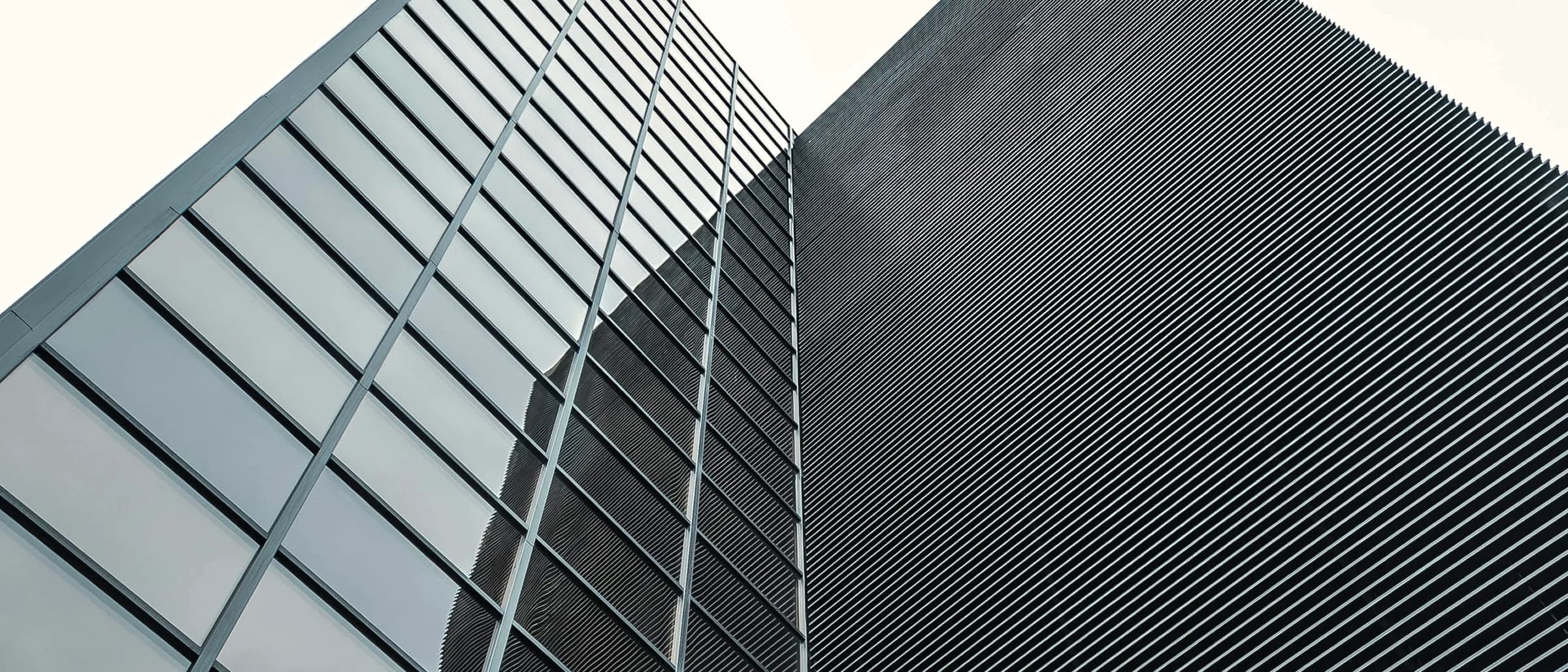 A facade of squares and lines, the openings set on a strict structural grid.