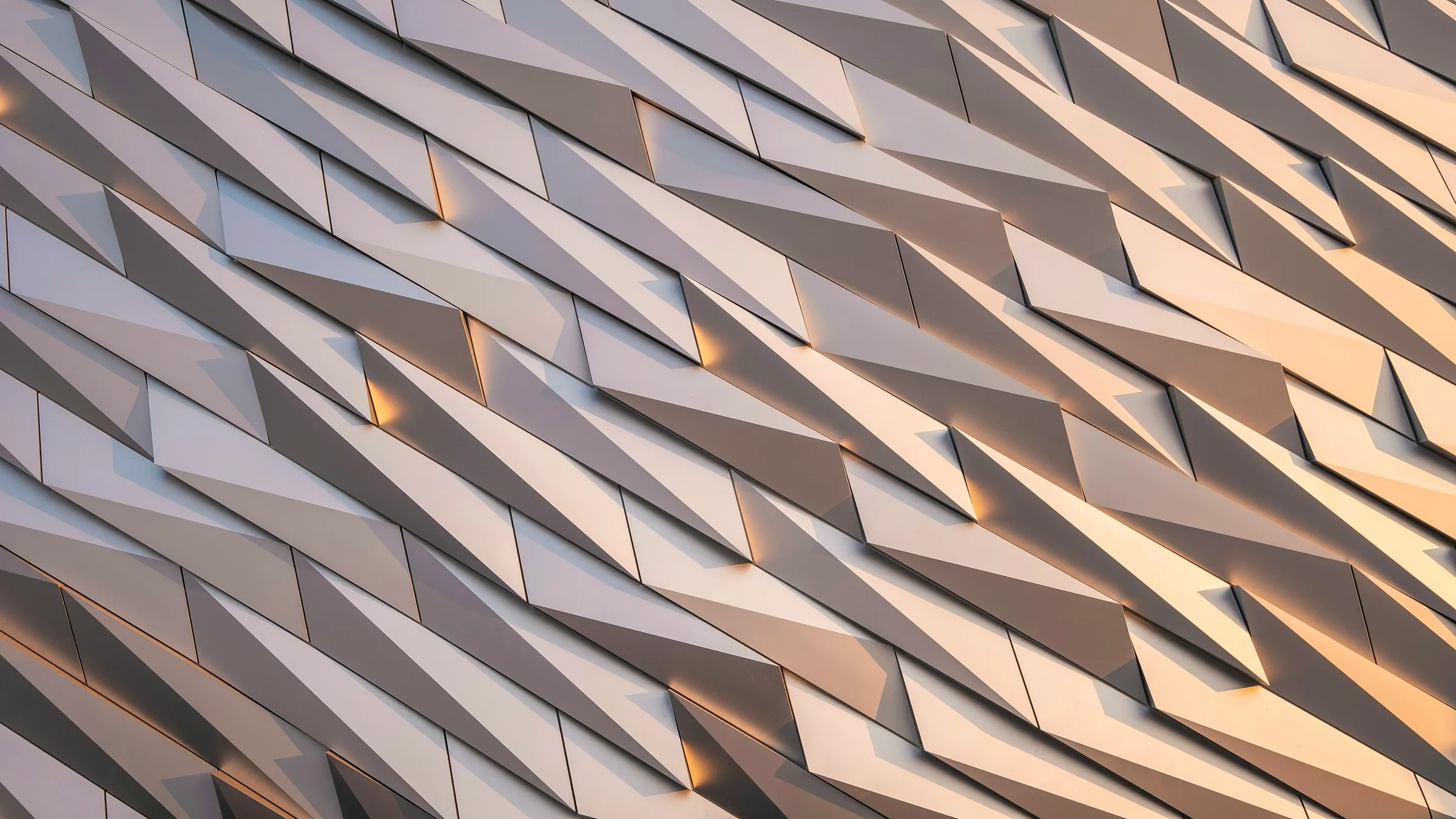 Angular metal cladding meeting at a sharp external corner.