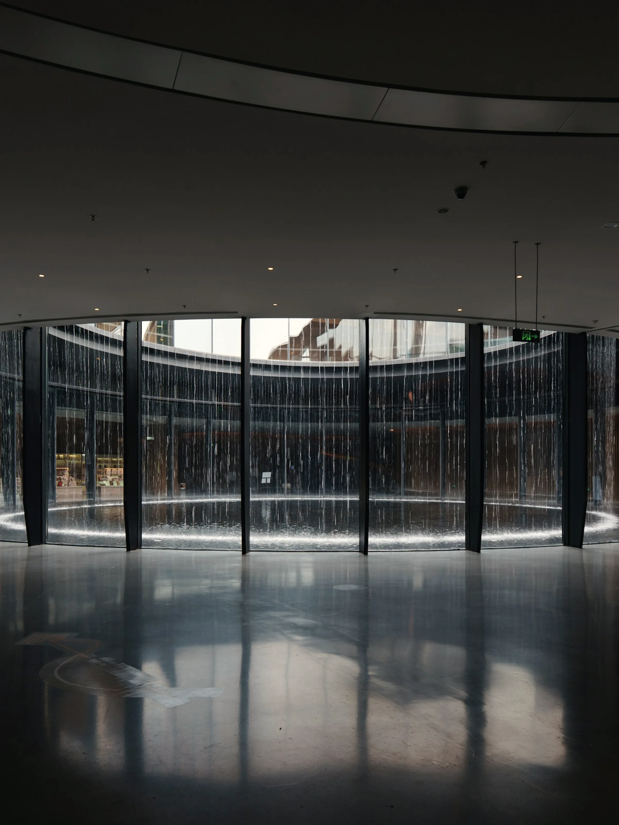 A dark curved atrium, its wall turning continuously around the void.
