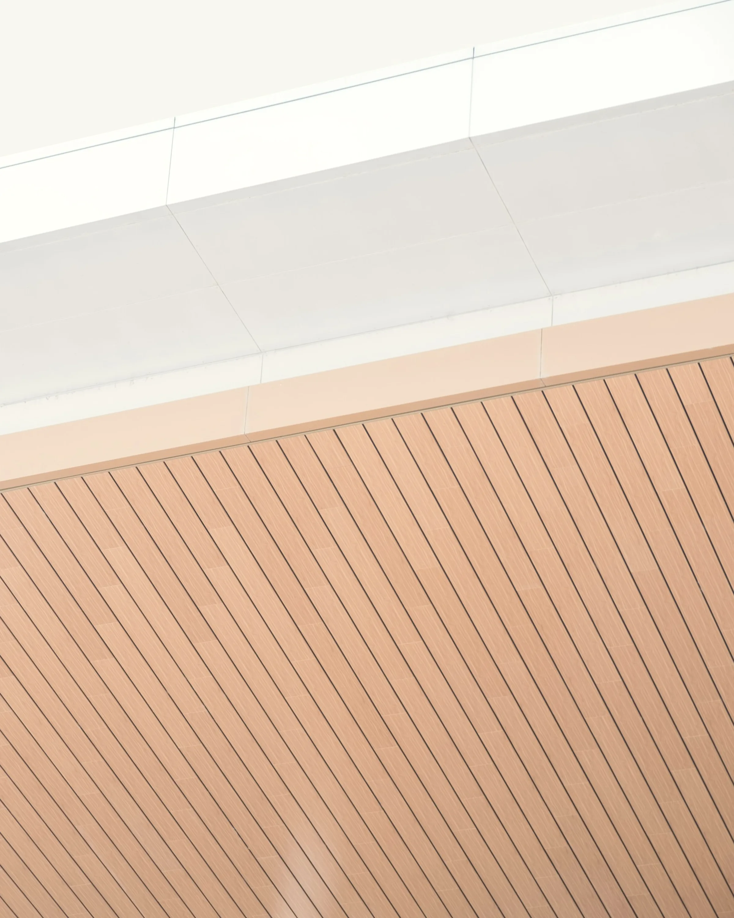 A ribbed soffit curving down to meet the wall below.